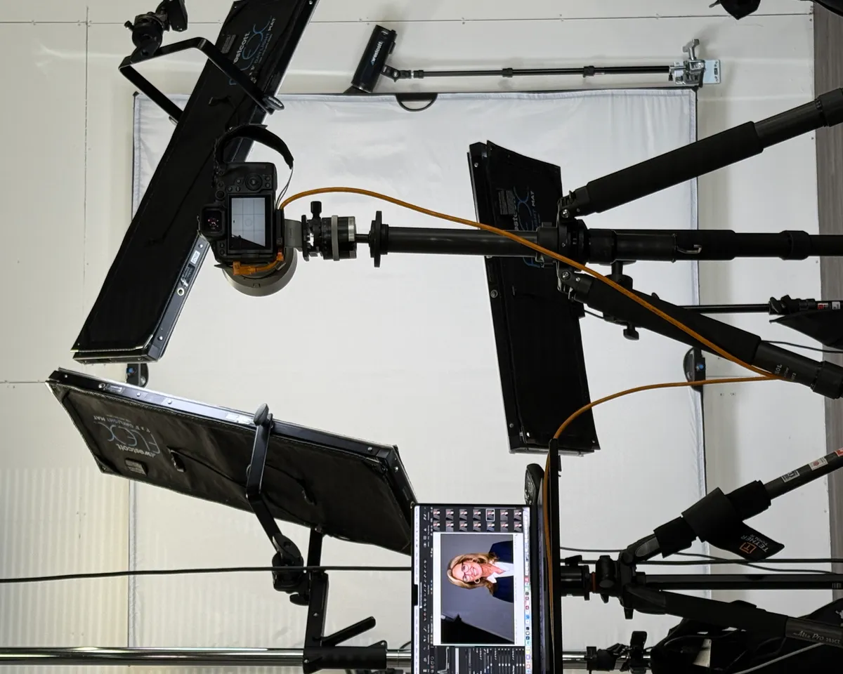 Professional headshot studio setup with tethered laptop showing real-time portrait — the screen-turn moment at Images by IBA Philadelphia