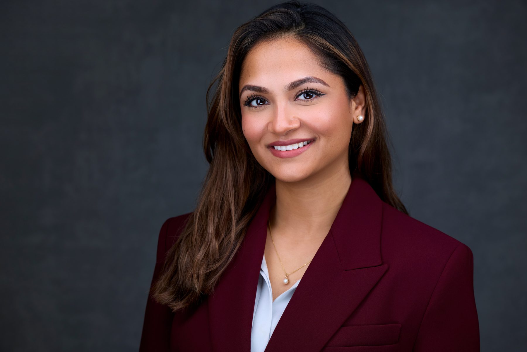 LinkedIn headshot transformation — same woman, professional studio result after a 20-minute session in Philadelphia